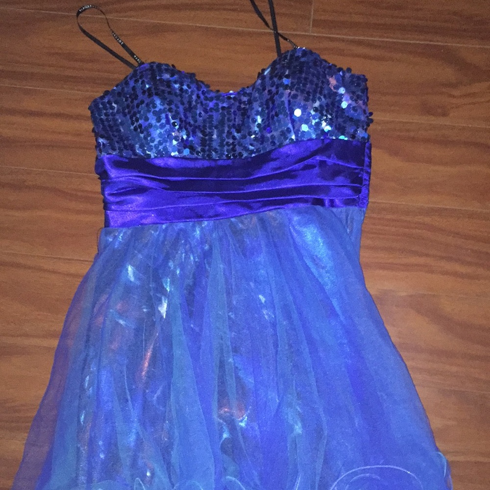 A blue shiny top part dress